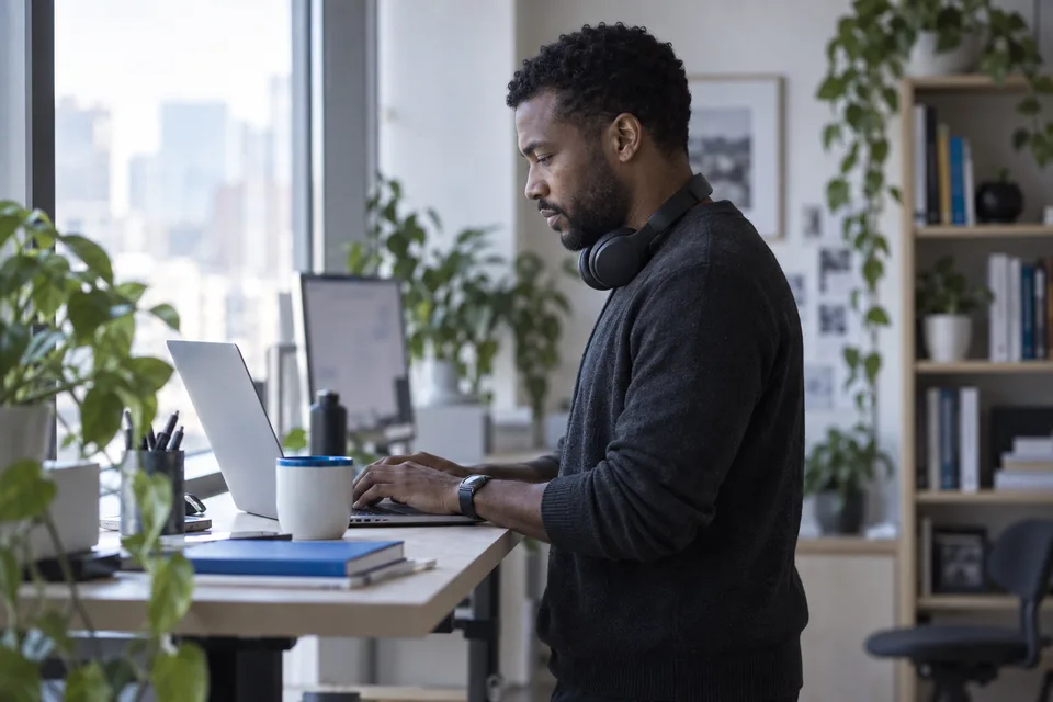A content lead publishing a page at a standing desk